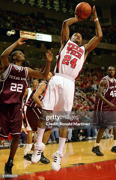 Guard Ronald Ross of the Texas Tech Red Raiders shoots against guard Dominique Kirk of the Texas A&M Aggies on January 15, 2005 at the United Spirit...