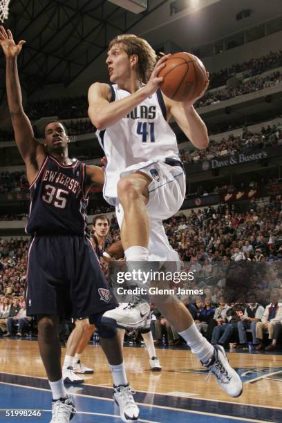 Dirk Nowitzki of the Dallas Mavericks looks to find a team mate to pass to against the New Jersey Nets January 15, 2005 at the American Airlines...