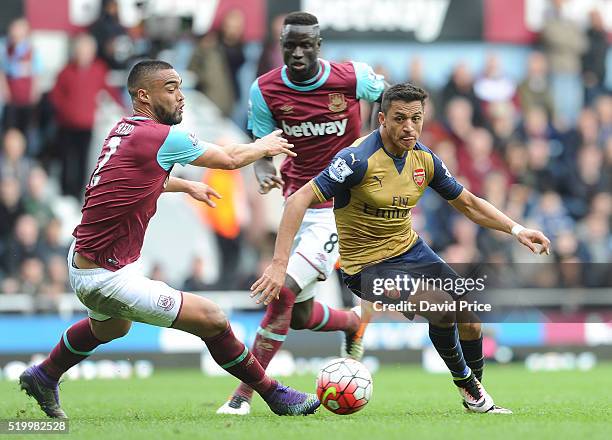 Alexis Sanchez of Arsenal takes on Winston Reid of West Ham during the Barclays Premier League match between West Ham United and Arsenal at The...