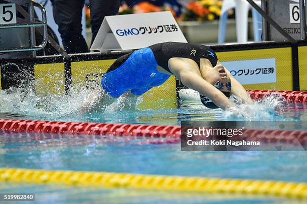 Natsumi Sakai dives in to start the Women's 200m Backstroke semi final during the Japan Swim 2016 at Tokyo Tatsumi International Swimming Pool on...