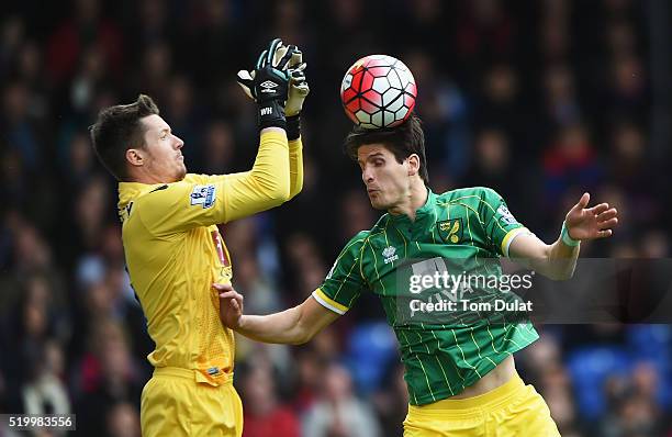 Timm Klose of Norwich City and Wayne Hennessey of Crystal Palace compete for the ball during the Barclays Premier League match between Crystal Palace...