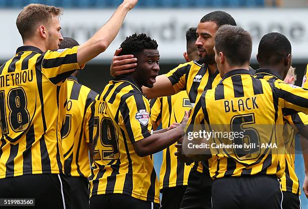 Larnell Cole of Shrewsbury Town celebrates after he scores a goal to make it 0-1 with his team mates during the Sky Bet League One match between...