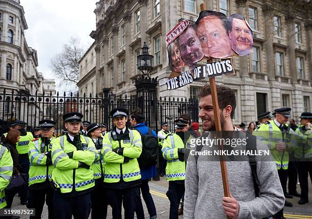Protesters demonstrate against British Prime Minister David Cameron following revelations in the Panama papers outside Downing Street in central...