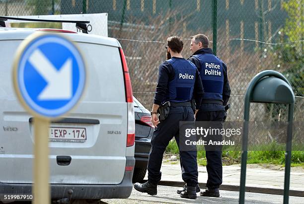 Belgian police officers standing guard in a street in Etterbeek, Brussels, as part of the investigation into the November 13 Paris attacks in which...