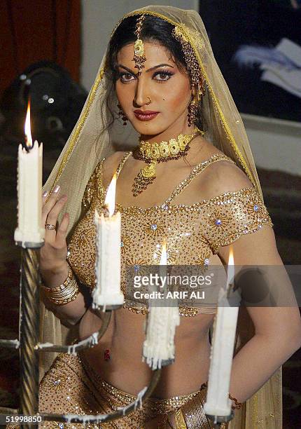 Pakistani film actress Sana poses during the shooting of the film 'Dako Hasina' in Lahore, 16 January 2005. Pakistan's film industry known as...