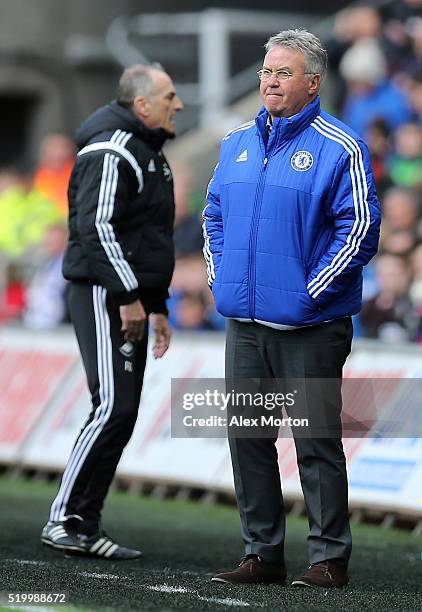 Francesco Guidolin, Manager of Swansea City and Guus Hiddink interim manager of Chelsea look on during the Barclays Premier League match between...