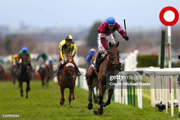 David Mullins celebrates as he rides Rule The World to victory in the 2016 Crabbie's Grand National at Aintree Racecourse on April 9, 2016 in...