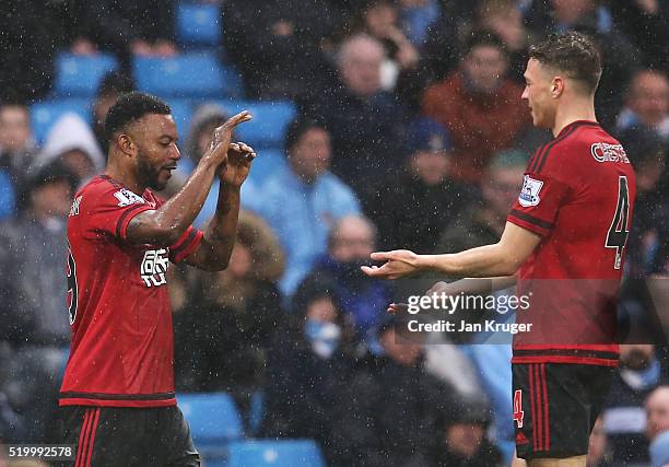 Stephane Sessegnon of West Bromwich Albion celebrates scoring his team's first goal with his team mate James Chester during the Barclays Premier...