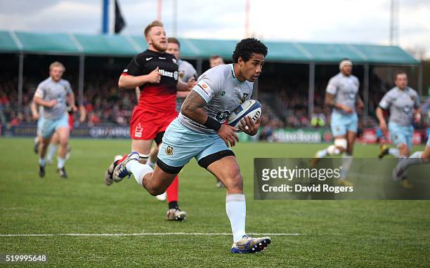 Ken Pisi of Northampton breaks clear to score the first try duirng the European Rugby Champions Cup quarter final match between Saracens and...