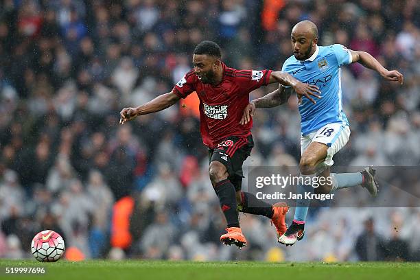 Stephane Sessegnon of West Bromwich Albion and Fabian Delph of Manchester City compete for the ball during the Barclays Premier League match between...