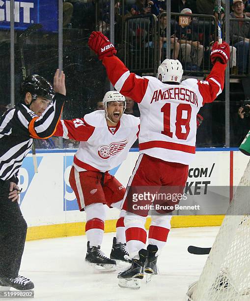 Luke Glendening and Joakim Andersson of the Detroit Red Wings celebrate a first period goal that was later disallowed against the New York Rangers at...