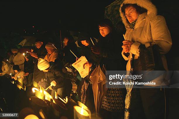 Mourners light up candles to commemorate the 10th anniversary of the 1995 earthquake in Kobe on January 17, 2005 in Kobe, Japan. The earthquake...