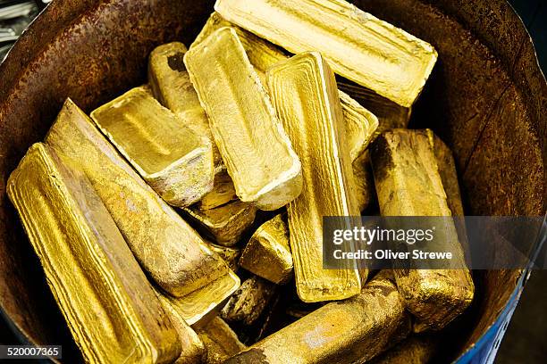 goldern ingots - gold bars stock pictures, royalty-free photos & images