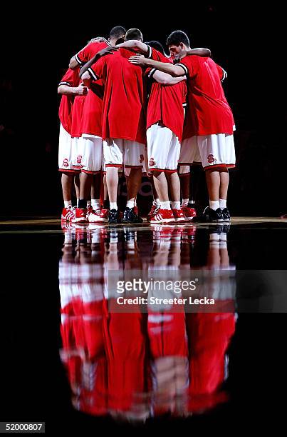 The North Carolina State Wolfpack huddle together before the start of their game against the Georgia Tech Yellow Jackets on January 16, 2005 at the...