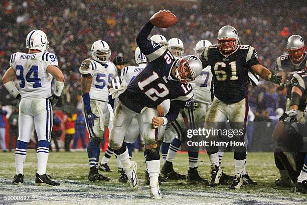 Quarterback Tom Brady of the New England Patriots spikes the ball after scoring a touchdown against the Indianapolis Colts during the AFC divisional...