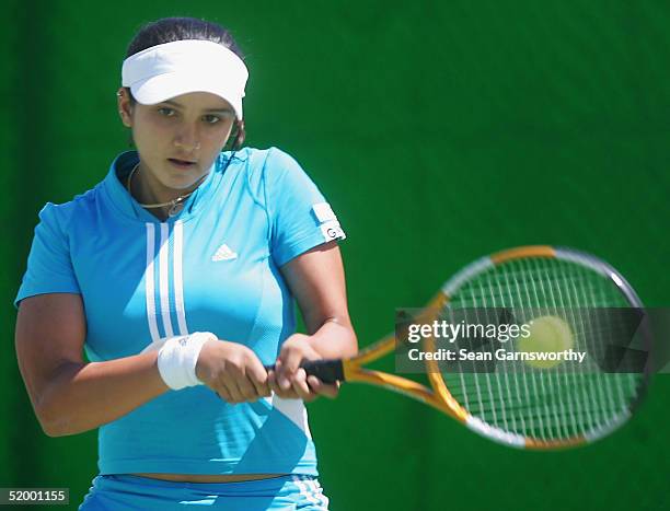 Sania Mirza of India hits a backhand against Cindy Watson of Australia during day one of the Australian Open Grand Slam at Melbourne Park January 17,...