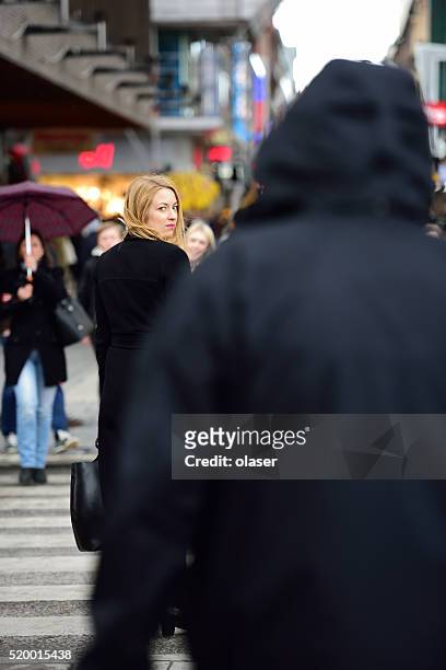 swedish blonde woman, followed? - stalking stock pictures, royalty-free photos & images