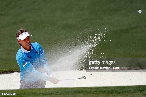 Bernhard Langer of Germany plays a shot from a bunker on the second hole during the third round of the 2016 Masters Tournament at Augusta National...