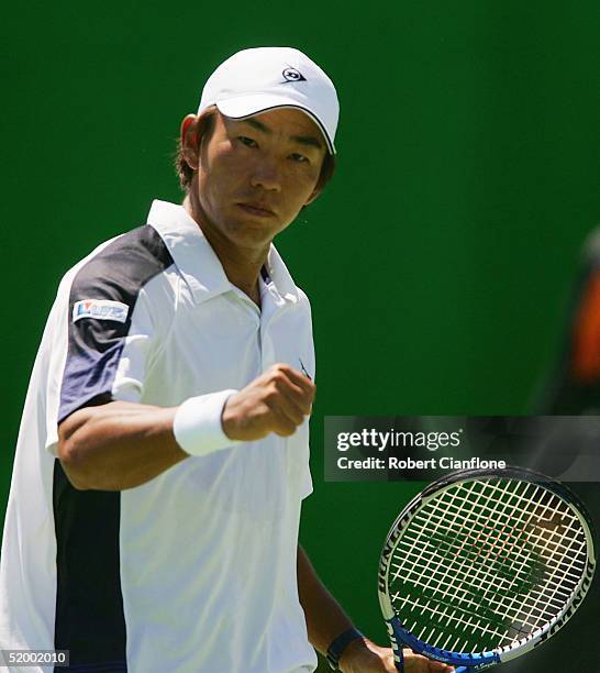 Takao Suzuki of Japan celebrates a point during his match against Jan-Michael Gambill of the USA on day one of the Australian Open Grand Slam at...