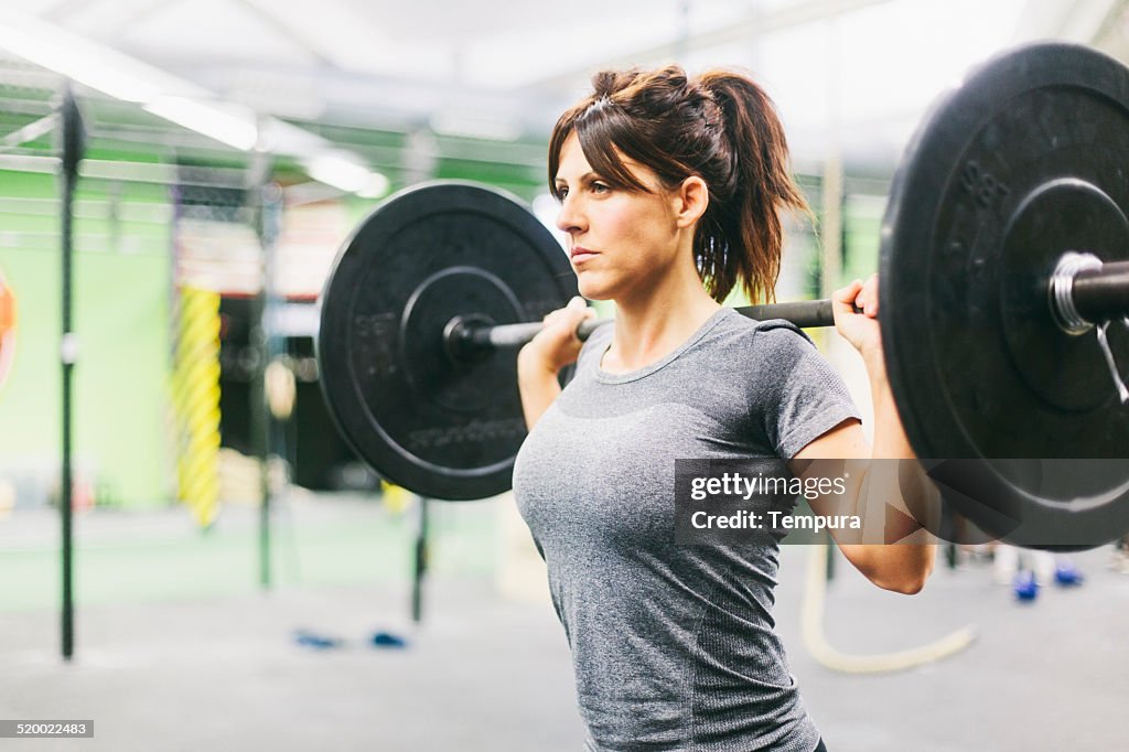 Young woman in intensity training session.