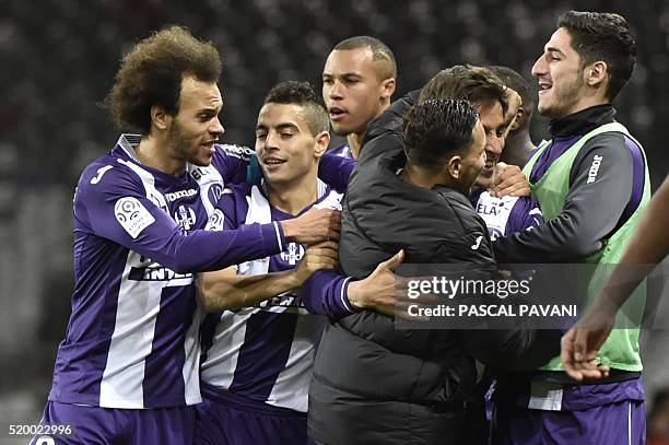 Toulouse's Italian Argentinian midfielder Oscar Trejo celebrates with teammates after scoring a goal during the French L1 football match Bastia on...