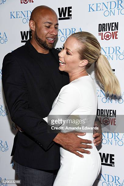 Television personalities Hank Baskett and Kendra Wilkinson arrive at the WE tv celebration of the premiere of 'Kendra On Top' and 'Driven To Love' at...