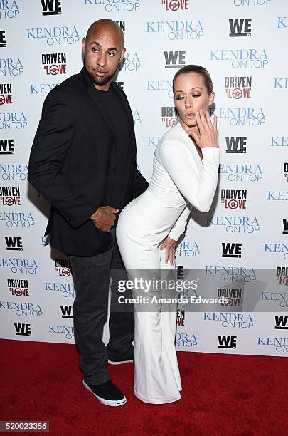 Television personalities Hank Baskett and Kendra Wilkinson arrive at the WE tv celebration of the premiere of 'Kendra On Top' and 'Driven To Love' at...