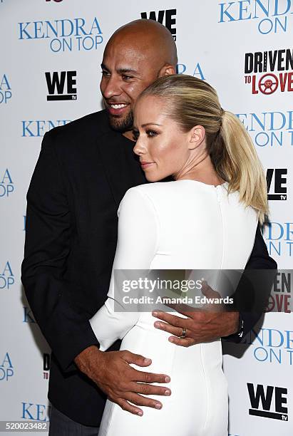 Television personalities Hank Baskett and Kendra Wilkinson arrive at the WE tv celebration of the premiere of 'Kendra On Top' and 'Driven To Love' at...