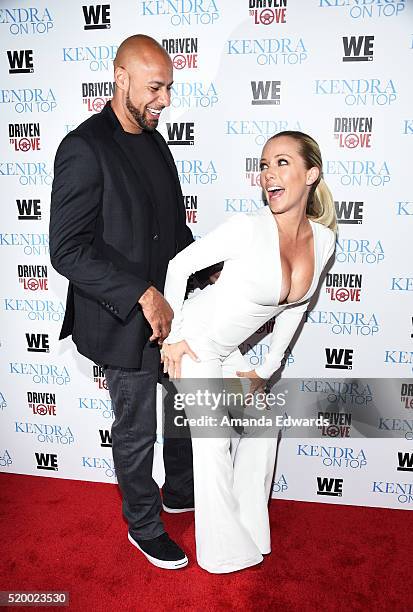 Television personalities Hank Baskett and Kendra Wilkinson arrive at the WE tv celebration of the premiere of 'Kendra On Top' and 'Driven To Love' at...