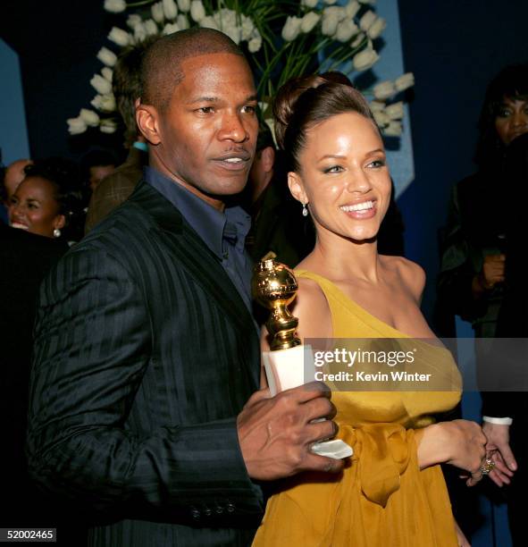 Actor Jamie Foxx and his girlfriend Leila Arcieri pose after he won the award for Best actor in a Leading Role - Musical or Comedy at the 62nd Annual...