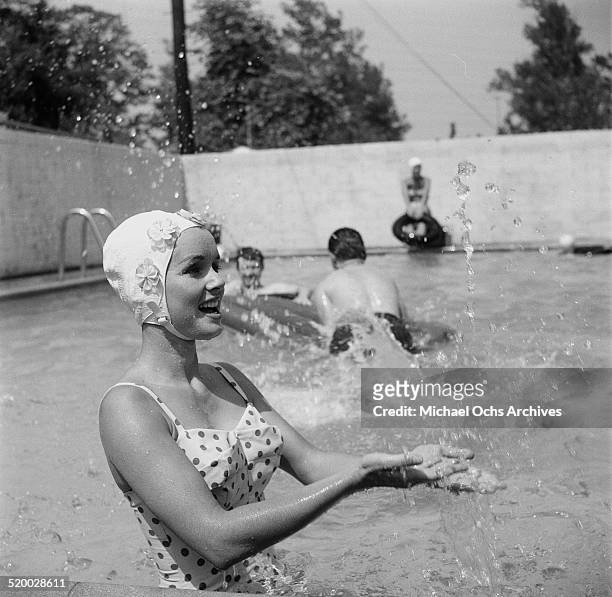 Actress Debbie Reynolds entertains guest at her pool party in Los Angeles,CA.