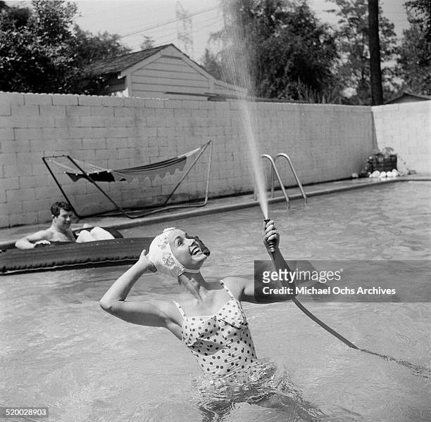 Actress Debbie Reynolds entertains guest at her pool party in Los Angeles,CA.
