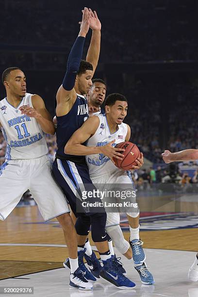 Marcus Paige of the North Carolina Tar Heels drives against Josh Hart of the Villanova Wildcats during the 2016 NCAA Men's Final Four Championship at...
