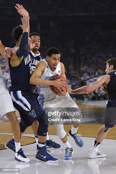 Marcus Paige of the North Carolina Tar Heels drives against Josh Hart of the Villanova Wildcats during the 2016 NCAA Men's Final Four Championship at...