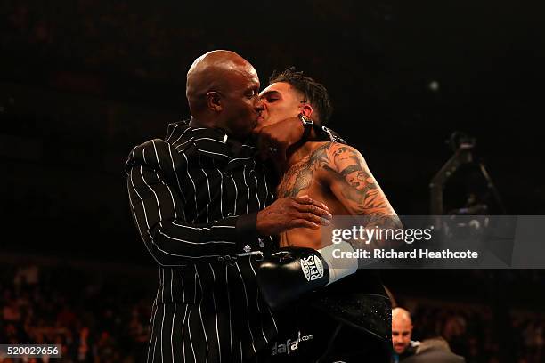 Nigel Benn kisses his son Conor Benn of England after he defeated Ivailo Boyanov of Bulgaria during the Super-Lightweight contest at The O2 Arena on...