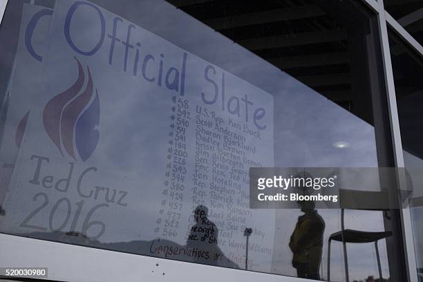 Sign showing the delegates supporting to Senator Ted Cruz, a Republican from Texas and 2016 presidential candidate, not pictured, hangs in a window...