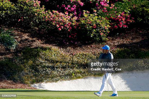 Rory McIlroy of Northern Ireland reacts on the 12th green during the third round of the 2016 Masters Tournament at Augusta National Golf Club on...