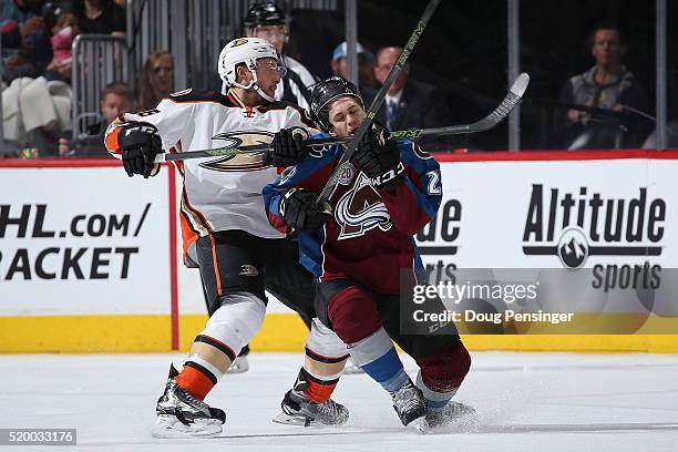 Ryan Garbutt of the Anaheim Ducks draws penalties for high-sticking and unsportsmanlike conduct on this play against Andrew Agozzino of the Colorado...