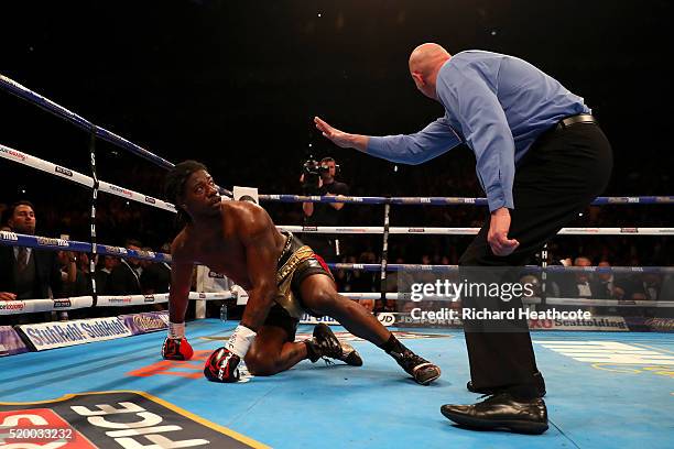 Charles Martin of the United States watches the referee as he counts him out during the IBF World Heavyweight title fight against Anthony Joshua of...