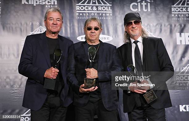 Ian Gillan, Ian Paice, and Roger Glover of Deep Purple pose on stage in the press room at the 31st Annual Rock And Roll Hall Of Fame Induction...