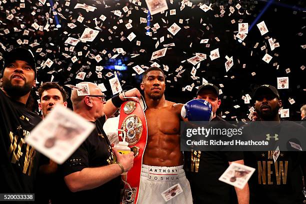 Anthony Joshua of England celebrates with the belt after defeating Charles Martin of the United States in action during the IBF World Heavyweight...