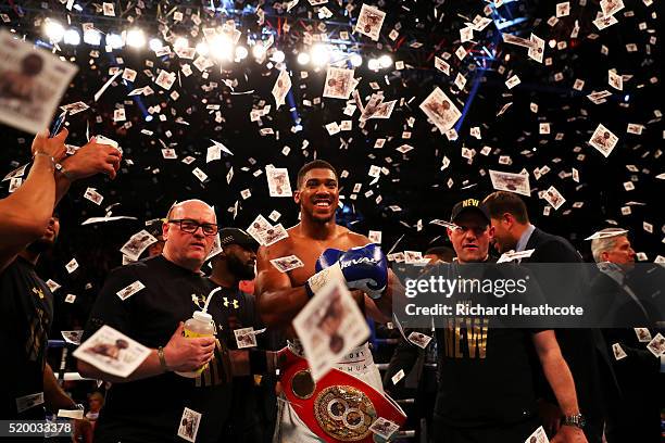 Anthony Joshua of England celebrates with the belt after defeating Charles Martin of the United States in action during the IBF World Heavyweight...