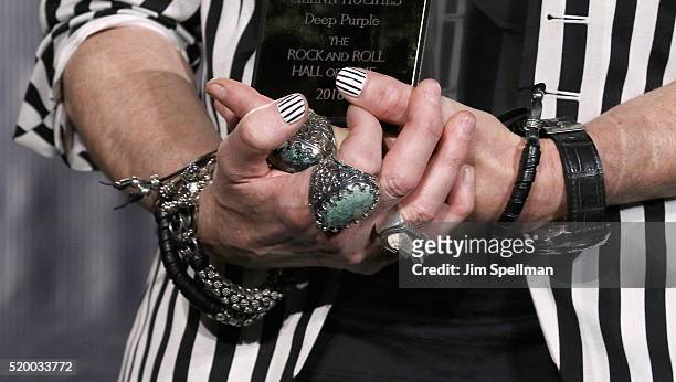 Musician Glenn Hughes, jewelry detail, of Deep Purple poses onstage in the press room during the 31st Annual Rock And Roll Hall Of Fame Induction...