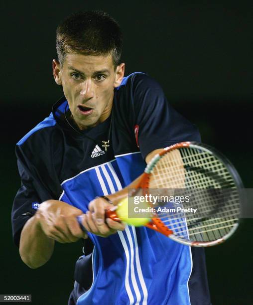 Novak Djokovic of SCG hits a forehand against Marat Safin of Russia during day one of the Australian Open Grand Slam at Melbourne Park January 17,...