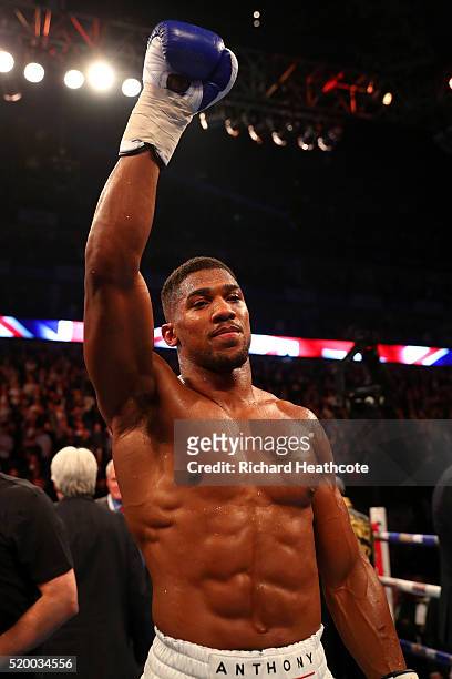 Anthony Joshua of England celebrates after defeating Charles Martin of the United States in action during the IBF World Heavyweight title fight at...