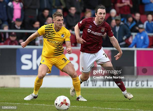 John-Joe O'Toole of Northampton Town and Lee Brown of Bristol Rovers challenge for the ball during the Sky Bet League Two match between Northampton...