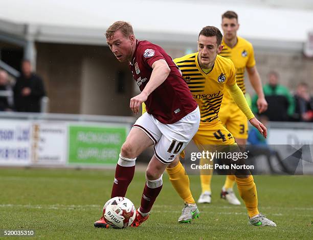 Nicky Adams of Northampton Town controls the ball watched by Tom Lockyer of Bristol Rovers during the Sky Bet League Two match between Northampton...