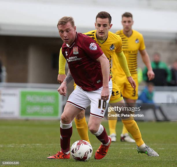 Nicky Adams of Northampton Town controls the ball watched by Tom Lockyer of Bristol Rovers during the Sky Bet League Two match between Northampton...