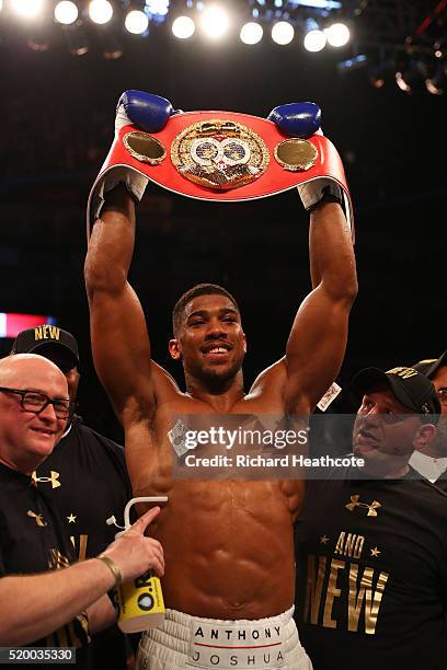 Anthony Joshua of England celebrates with the belt after defeating Charles Martin of the United States in action during the IBF World Heavyweight...