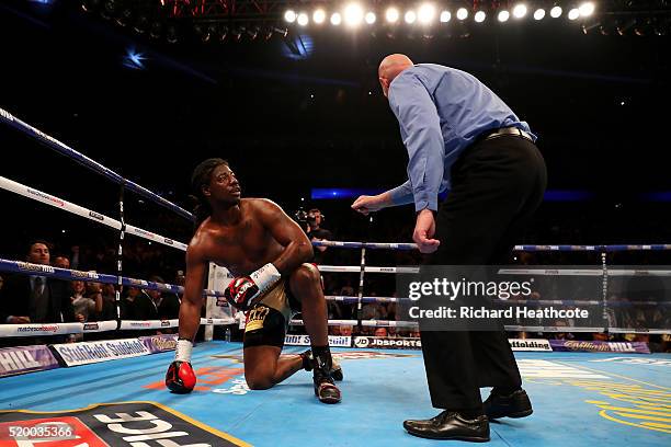 Charles Martin of the United States watches the referee as he counts him out during the IBF World Heavyweight title fight against Anthony Joshua of...